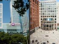 Side by side images of NYU Shanghai and NYU Stern