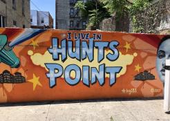 Image of a mural on the wall of a building that says I live in Hunts Point