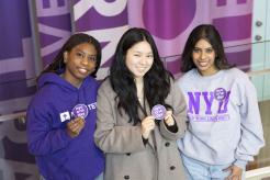 Students pose to support NYU One Day