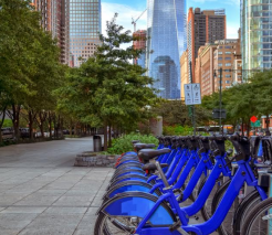 City sidewalk with bikeshare.