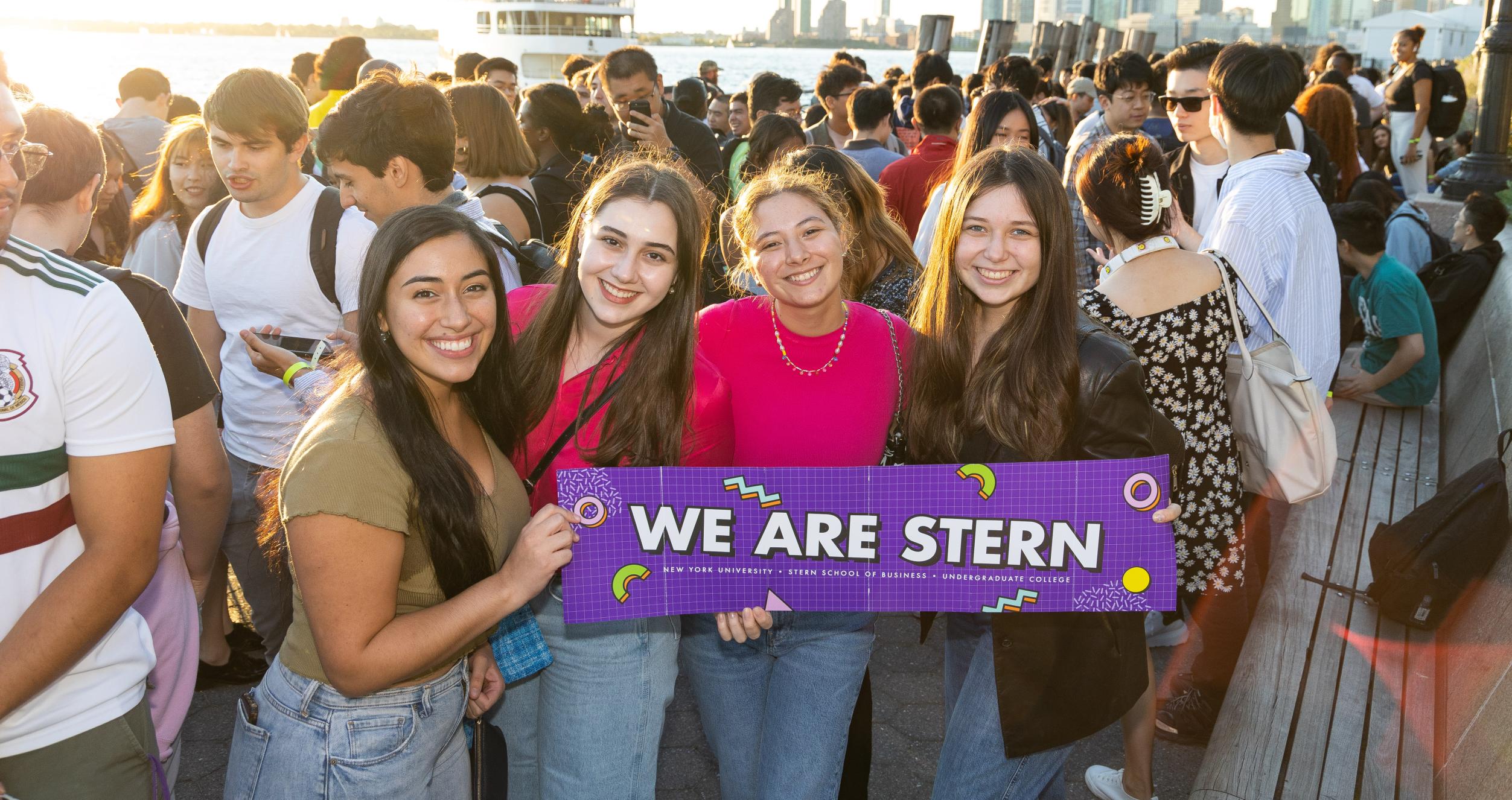 Students holding a WE ARE STERN banner