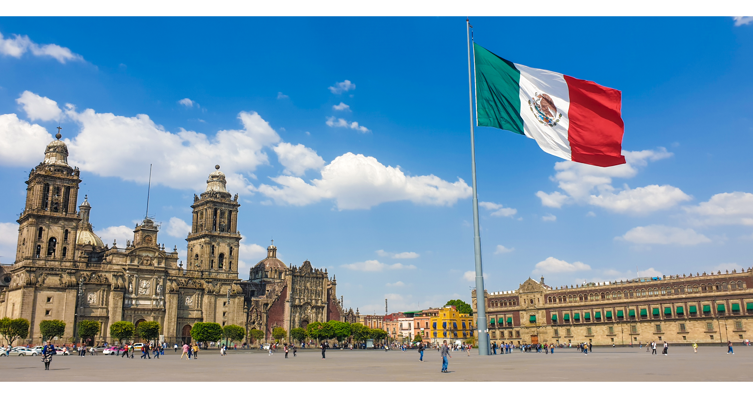 Mexico City's Zocalo with a Mexican flag in front of Mexico City Metropolitan Cathedral