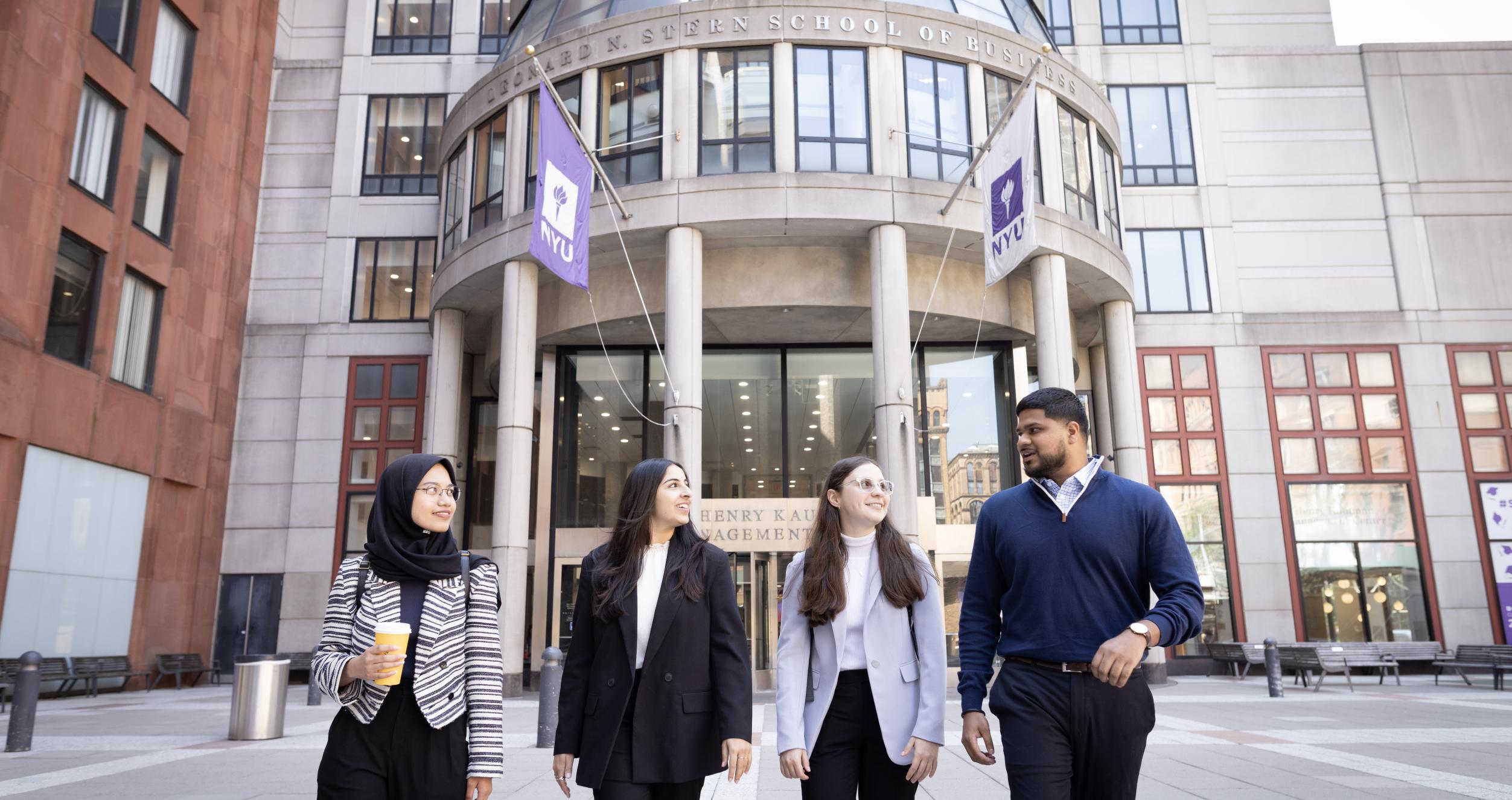 Students walk in front of Stern