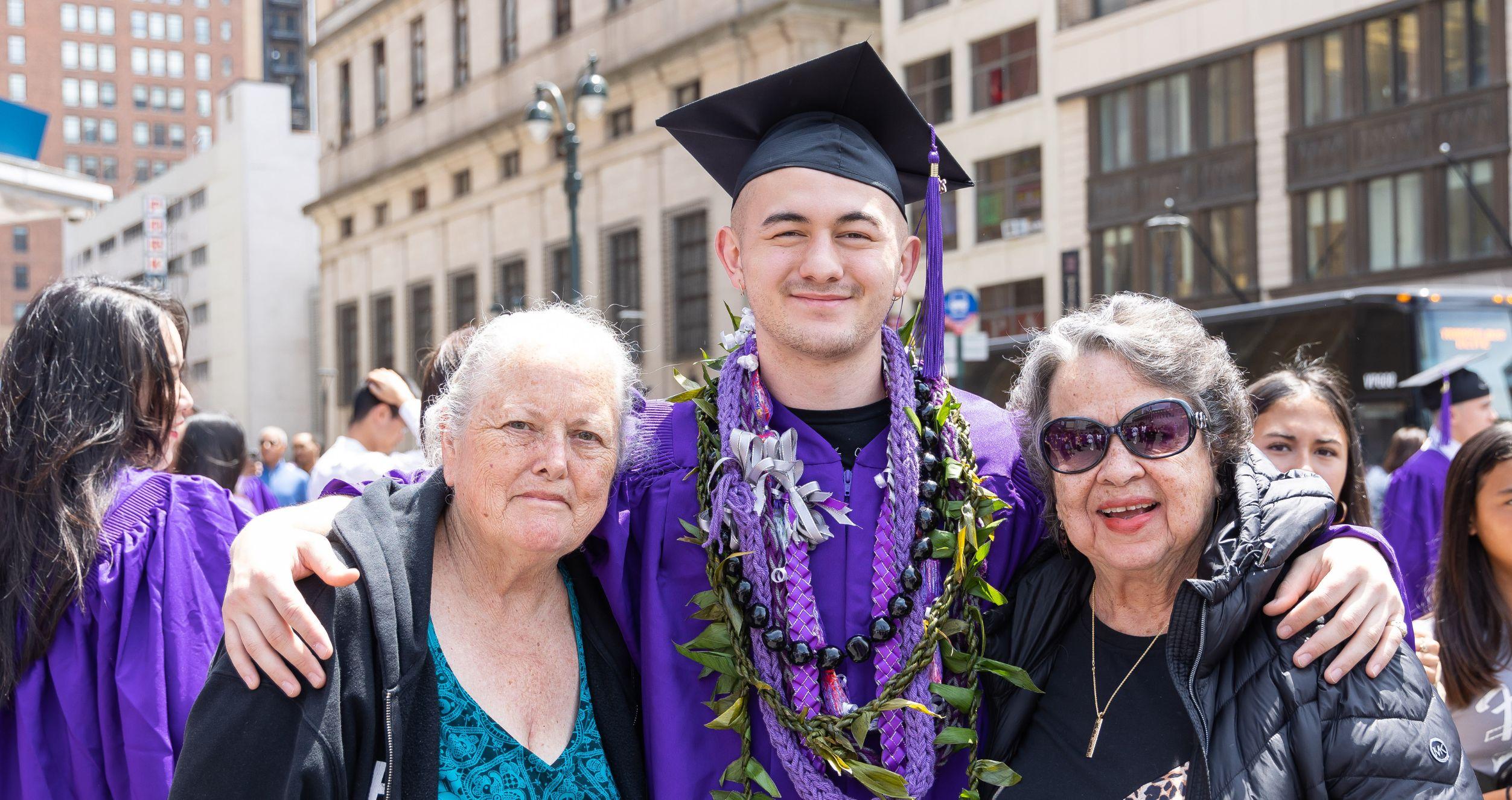 Graduation Stern senior posing with family members