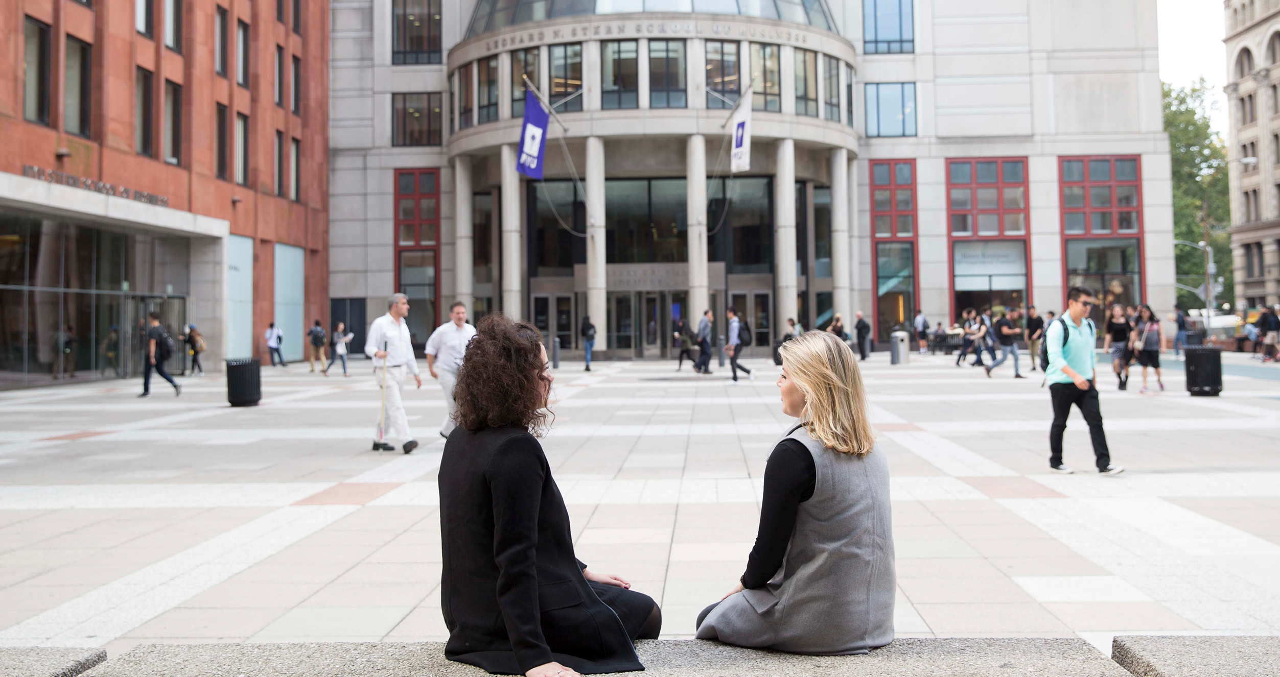 Two Women Sitting on Gould Plaza