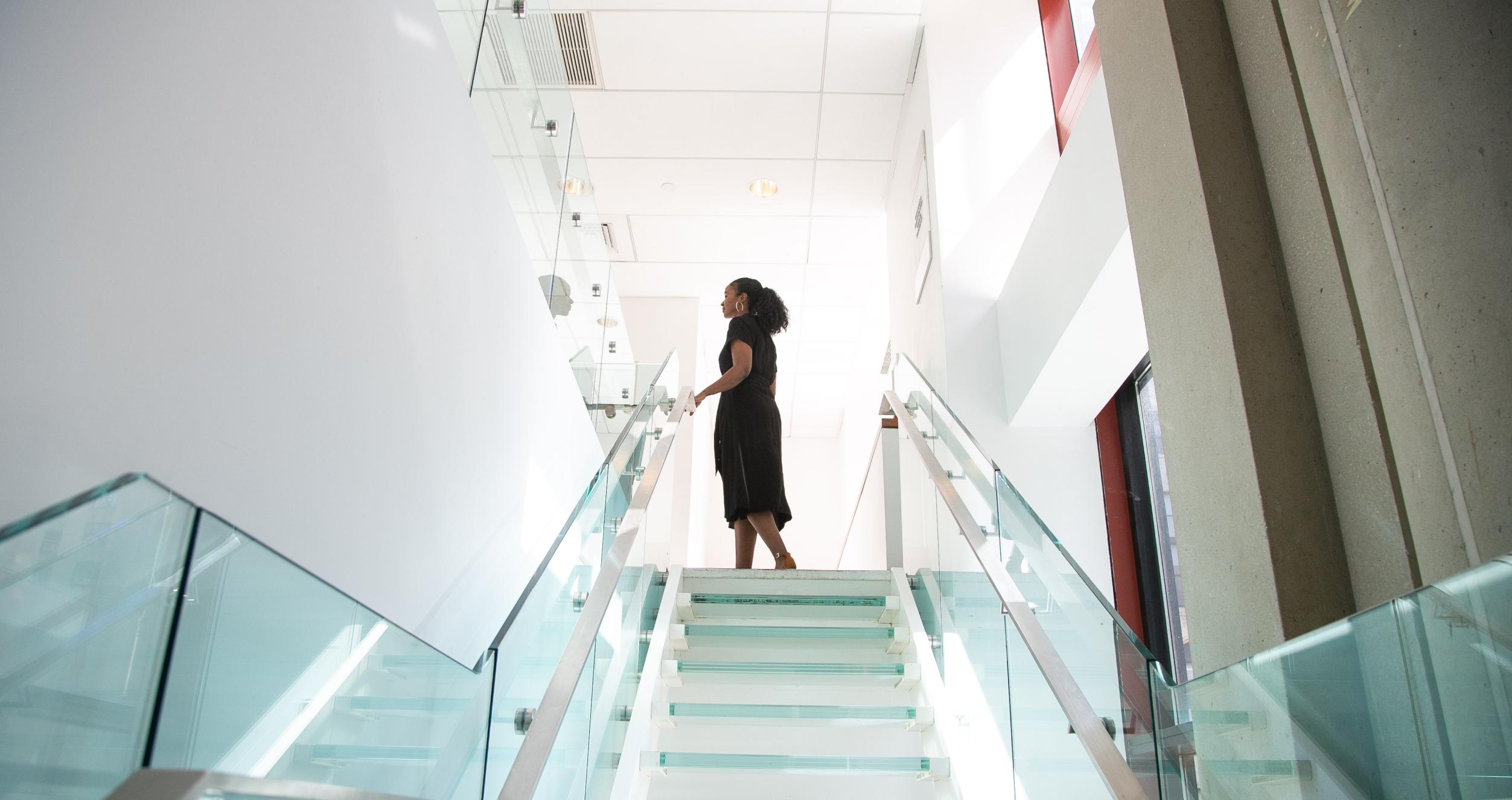 image of woman on top of staircase