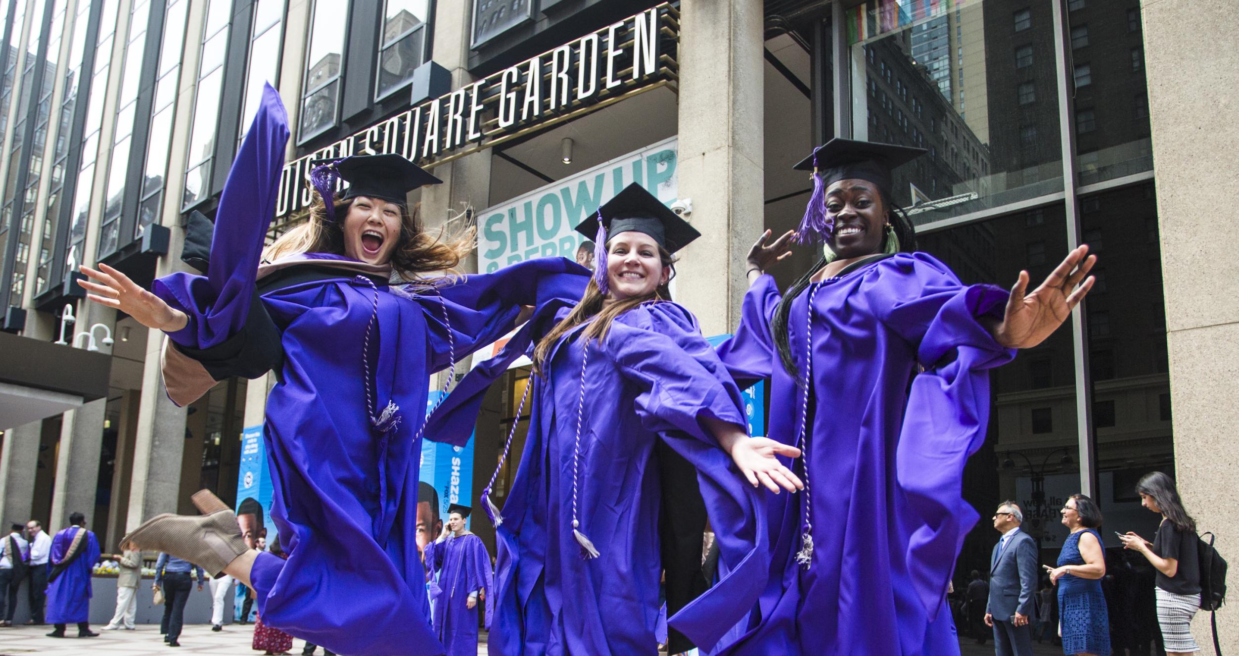 MBA graduates celebrate in front of Madison Square Garden