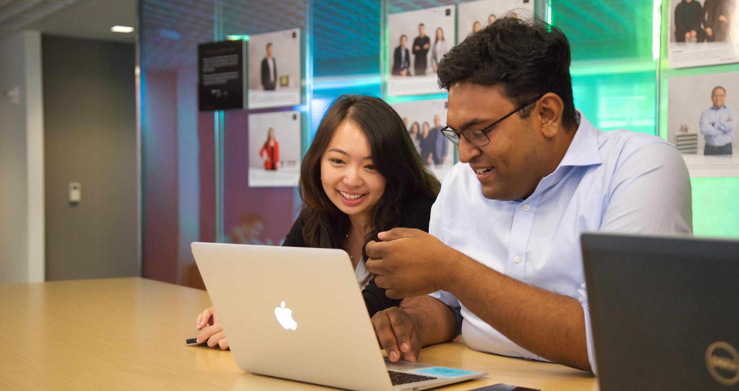 Alumni Resources Stern students looking at a computer