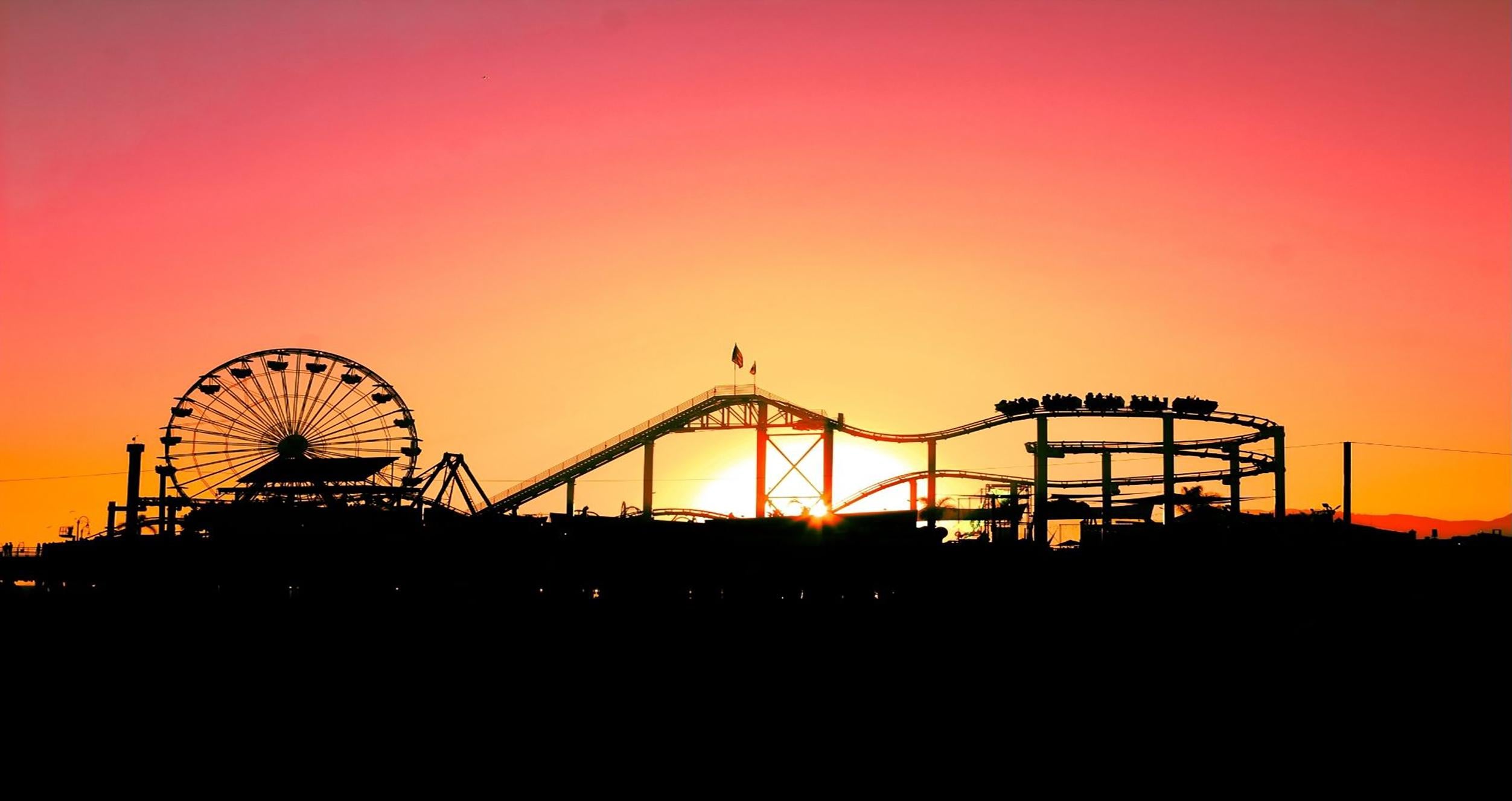 Ferris Wheel and roller coaster Image of amusement park with Ferris wheel and roller coaster