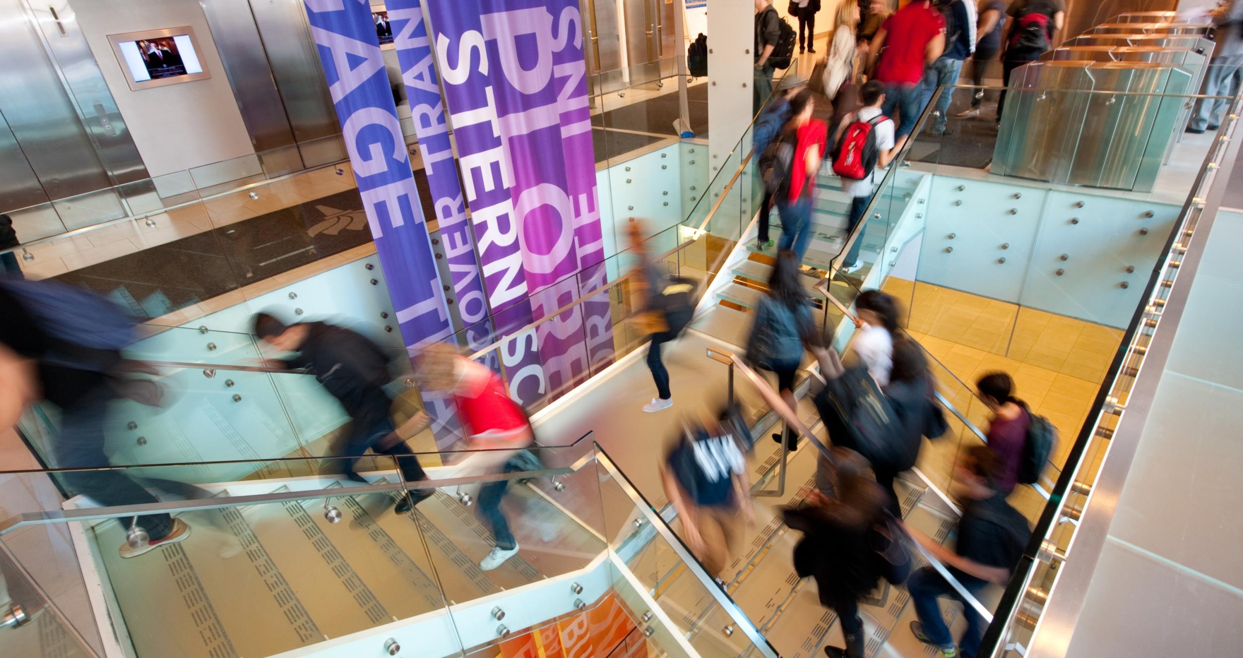 Stay Connected Students on the stairs of Tisch