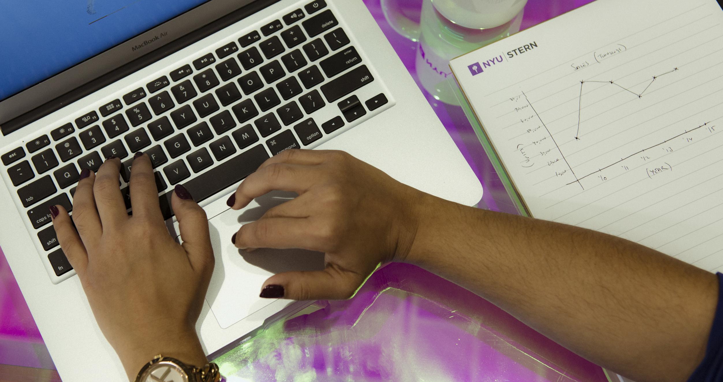 Woman's hands on laptop keyboard