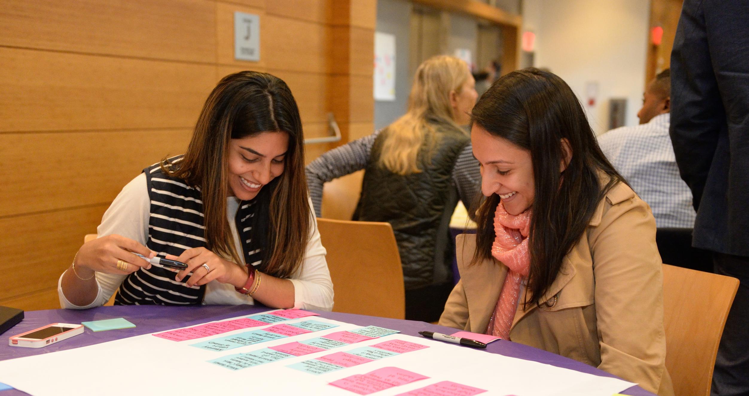 students collaborating at a table