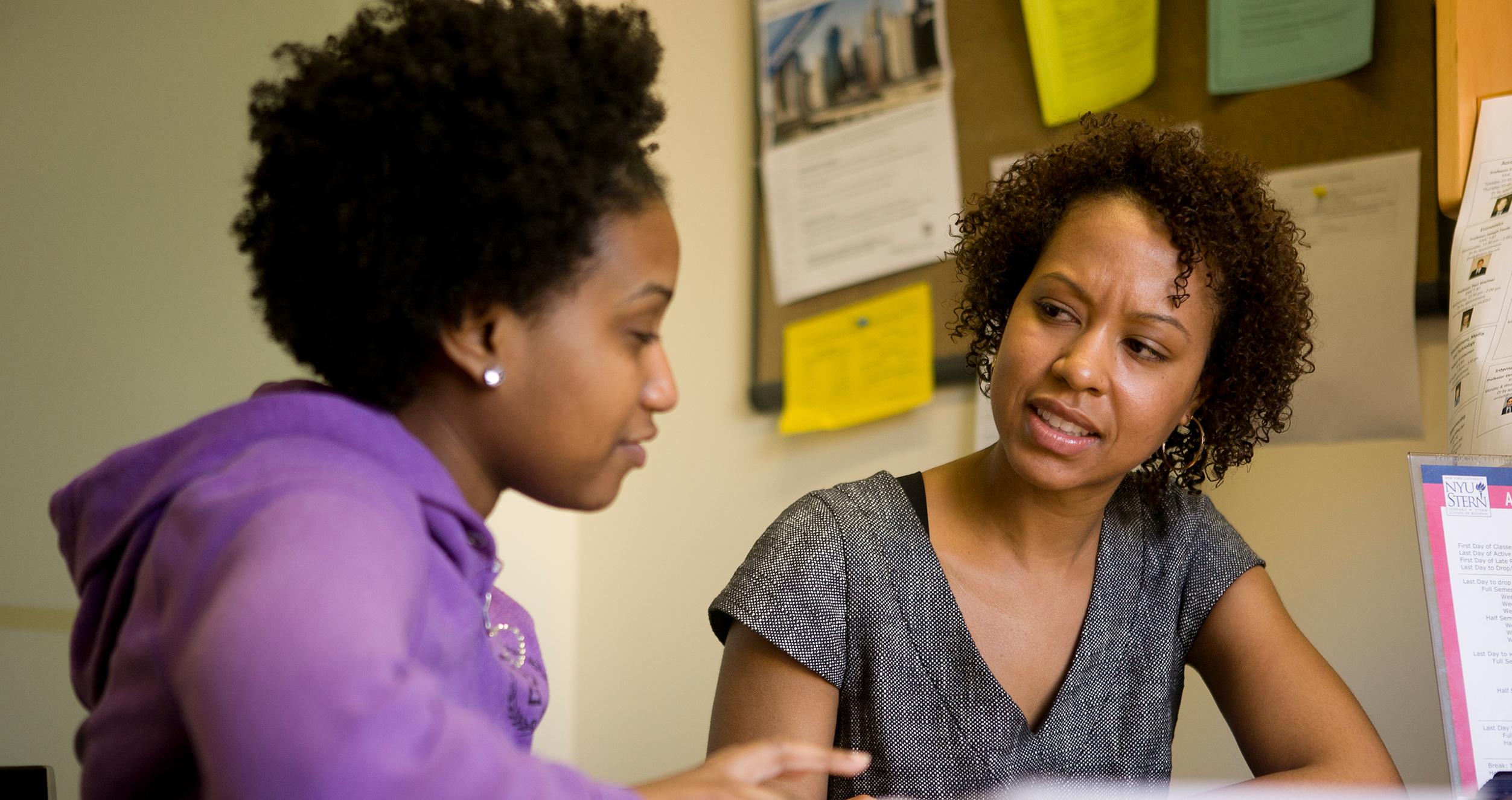 A student meets with an adviser one-on-one