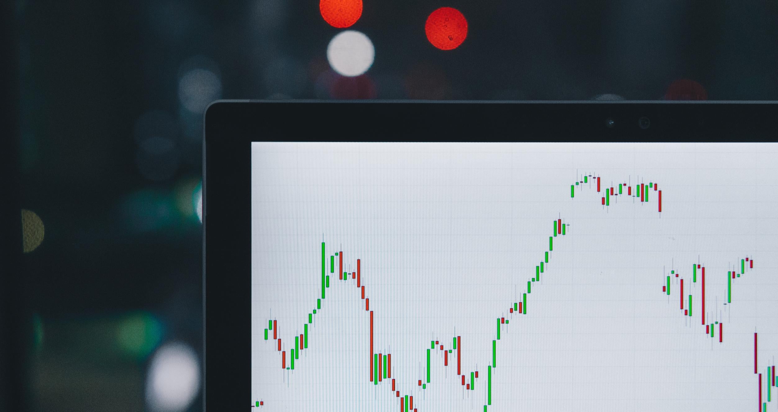 Selective focus photography of graph on computer screen