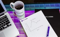 Mug and notepad with laptop