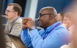 man listening to lecture