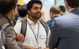 Student networking with classmates during a group interaction.