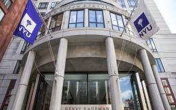 Front of KMC with NYU Flags