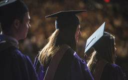 Grads walk across the stage at MSG