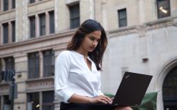 Student using laptop outside