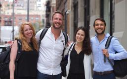 Four students posing outside