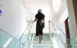 Woman walking up stairs