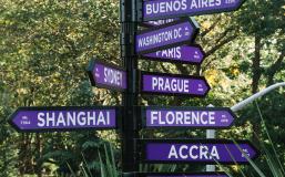 A sign on NYU's campus pointing to its other global sites