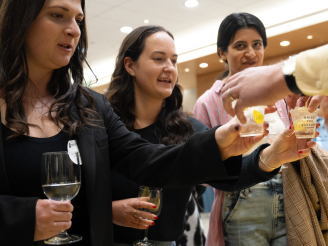 Alumni tasting beverages at Taste of Stern 2024