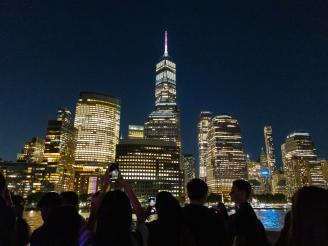 Undergraduate students taking photos of NYC skyline