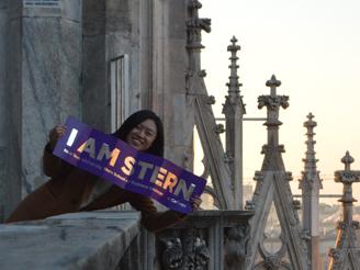 girl holding "I am Stern" banner on IBEX trip