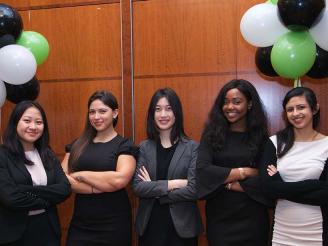 Five female Stern students at the USWIB Conference 