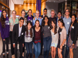 Group of returning Stern alumni posing during event