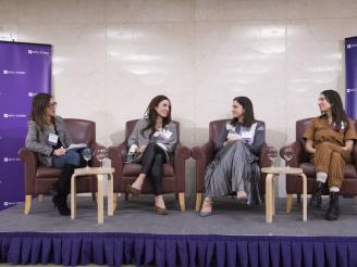 Four women talking together on panel at Stern 