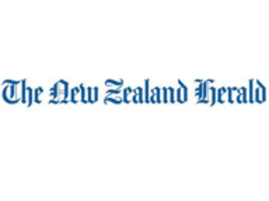 words "the new zealand herald" in blue font