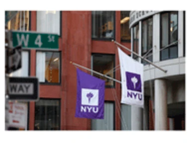 nyu flags flying in background of west 4th street sign