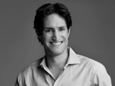 black and white headshot of professor adam alter