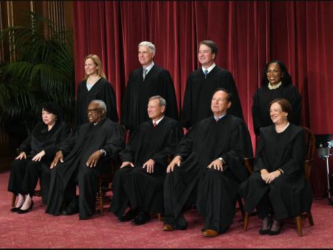 Supreme Court Justices Sitting for a portrait photoshoot 