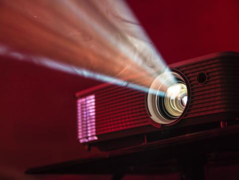 A projector shining a beam of light