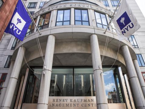 Front of KMC with NYU Flags