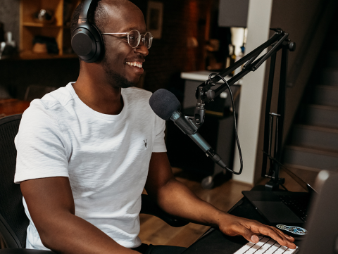 Person sitting in front of a microphone