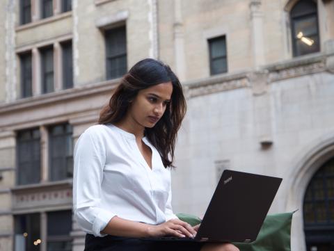 Student using laptop outside