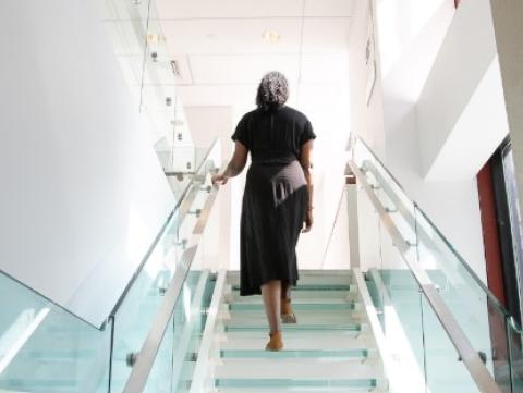 Woman walking up stairs