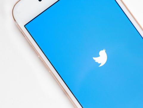 Smartphone with the Twitter logo on the screen
