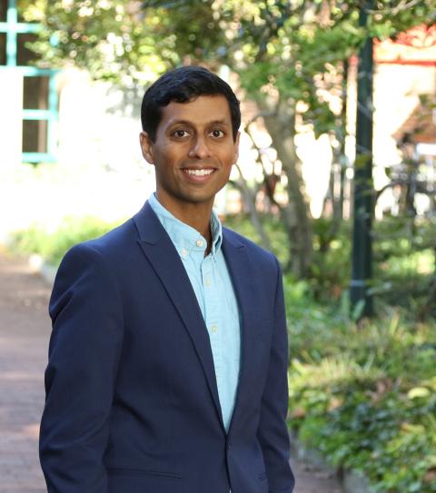 portrait of manav raj standing outside