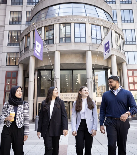 Students walk in front of Stern