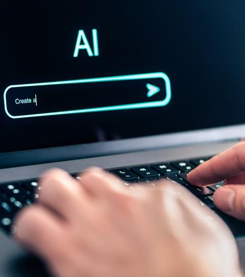 A user typing an AI prompt