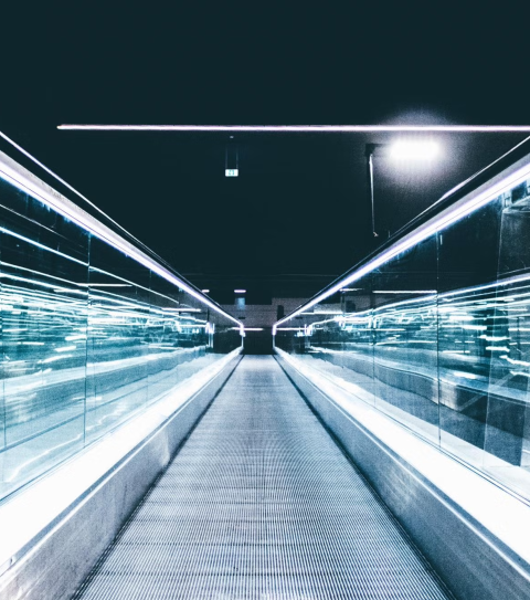 mechanical walkway with blue lights