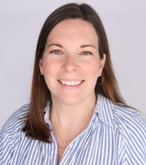 Lauren Calio is a woman wearing a striped button down shirt
