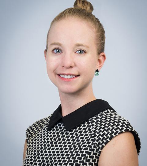 Catherine DiMarzo, Senior Associate Director, has blonde hair and wears a black and white shirt