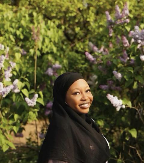 Bintou is a woman wearing a black hijab